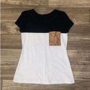 Black and white shirt with brown pocket. Size M